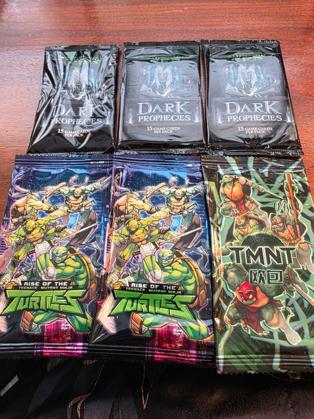 3PAKS OF DARK PROPHECIES AND 3 BOOSTER PAKS OF NIJA TURTLES ALL SEALED PAKS.